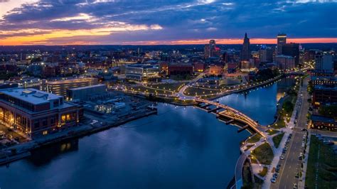 Curved pedestrian bridge links two riverfront parks in Providence ...